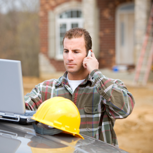 A Rapid Rain Response technician calling one of our trusted roofing parters to schedule a permanent fix for a client.